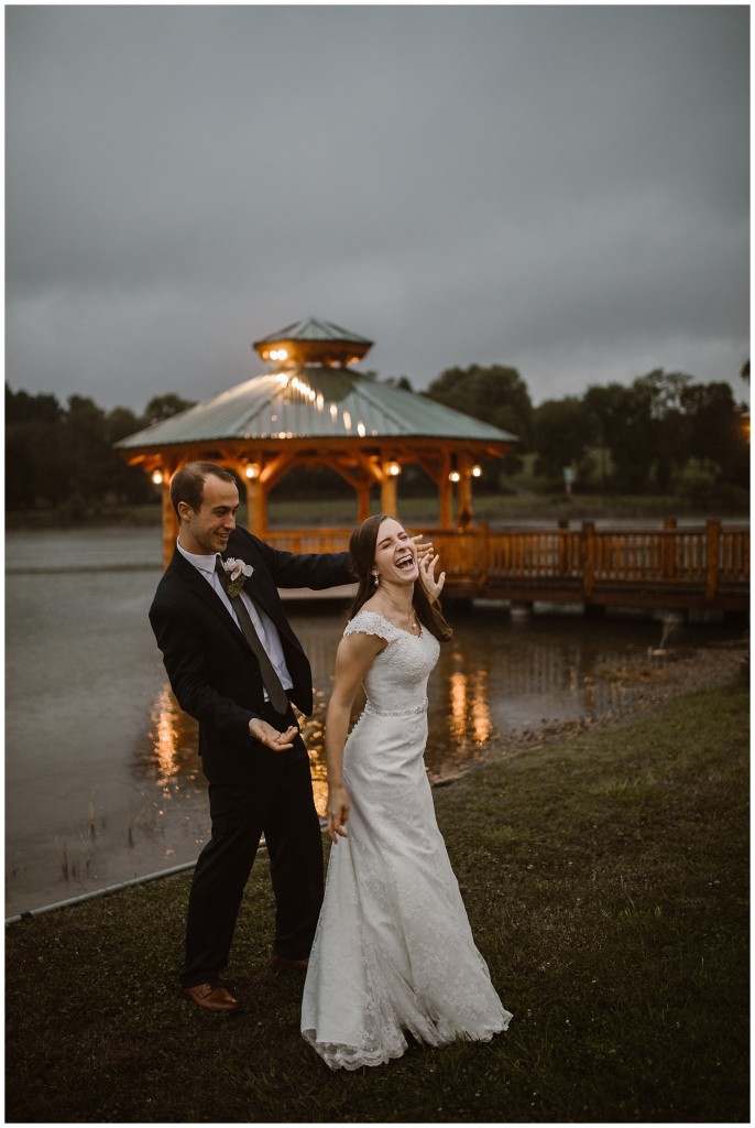 bride in groom in rain