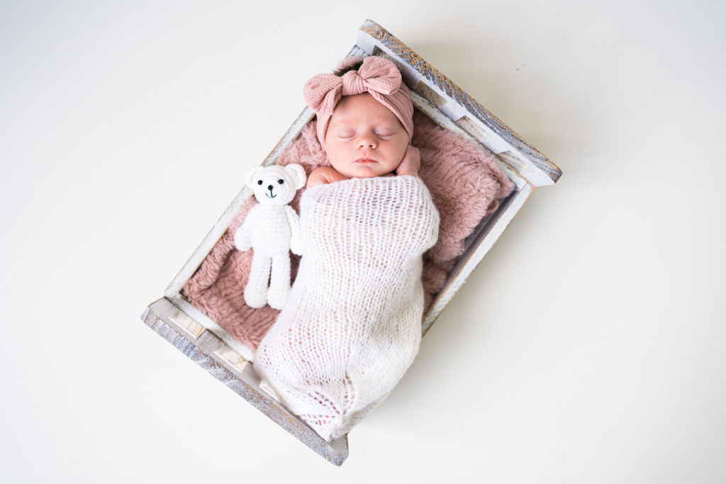 newborn girl and bow